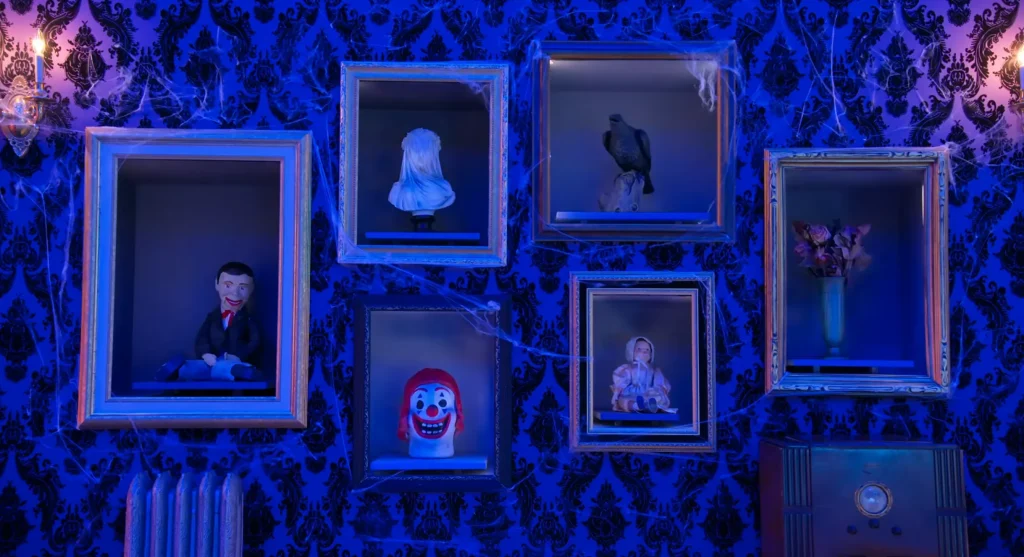 Is It Cake? Halloween Season 1 Review 4 Is It Cake Halloween Season 1 Review featuring a wall of Halloween props contestants had to guess whether was real or cake on Pop the Channel