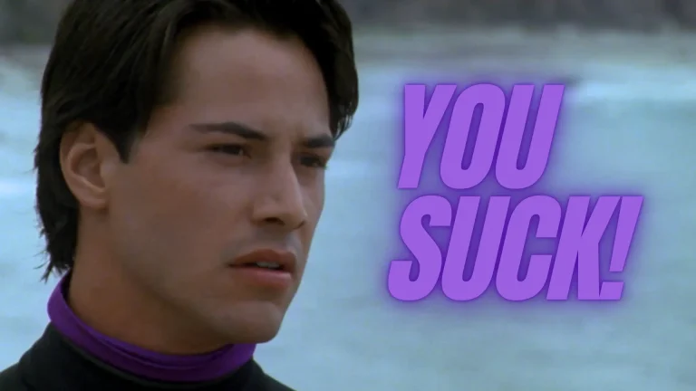 Point Break Review: Johnny Utah Is Really Bad at His Job Point Break 1991 Review featured image featuring Keanu Reeves with the words: "You Suck" in a purple text overlay on Pop the Channel