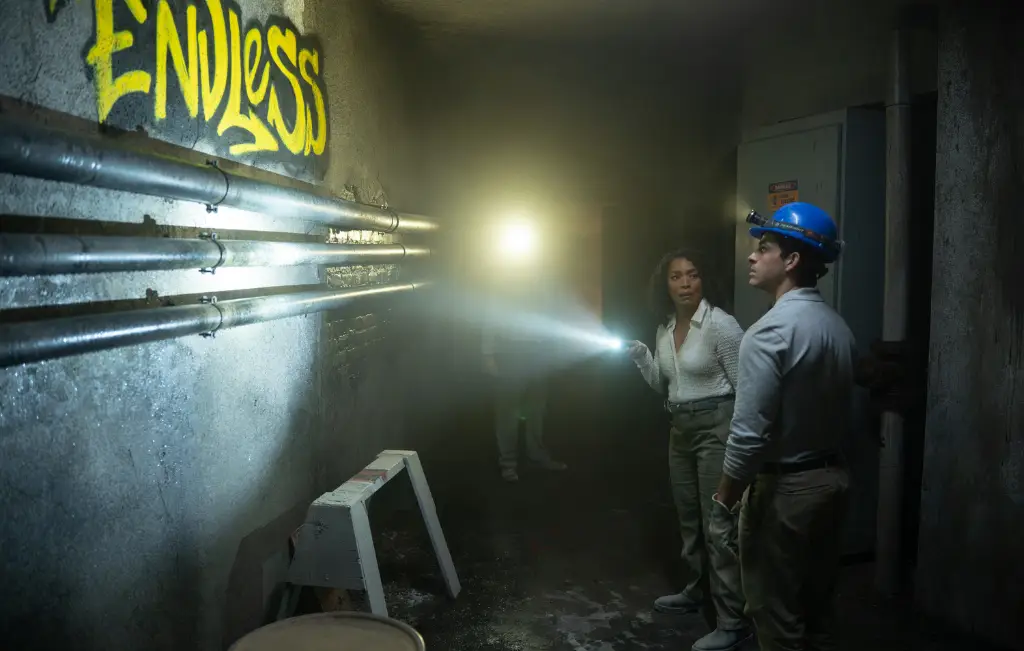 9-1-1 Season 10 Episode 1: "That Sinking Feeling" and 9-1-1 Season 10 Episode 2: "Fire in the Hole" Review featuring Athena in the tunnels with the world "Endless" graffitti'd on the wall on Pop the Channel