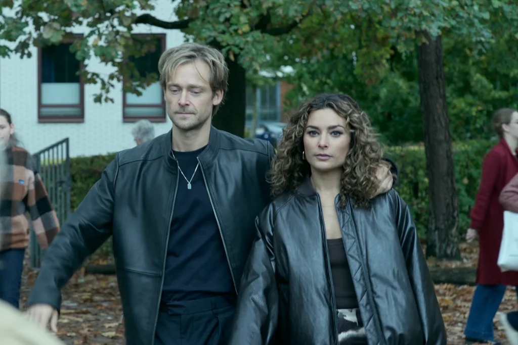 The Perfect Lie S1E7 Review: The Truth Comes Out. Then Netflix Pulls THAT Ending. 9 The Perfect Lie Season 1 Episode 7: "Ivo" Review featuring Patricia and Simon walking arm in arm to the school with Patricia staring directly at Karen.